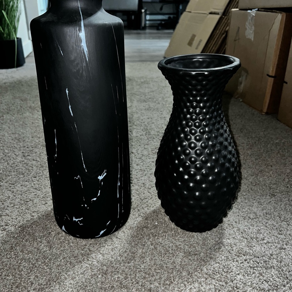 2 black flower vases